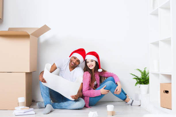 istock Young happy couple moving new home. 873925080