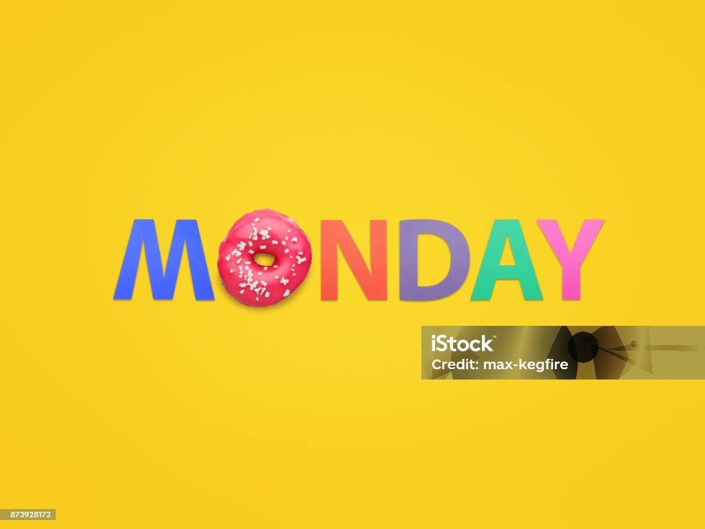 Word Monday composed on orange Creative composition of doughnut and colorful letters arranged on orange background. Monday Stock Photo