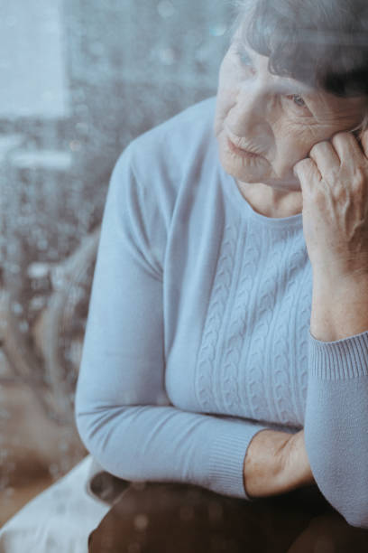 istock Elderly woman with migraine 873930008