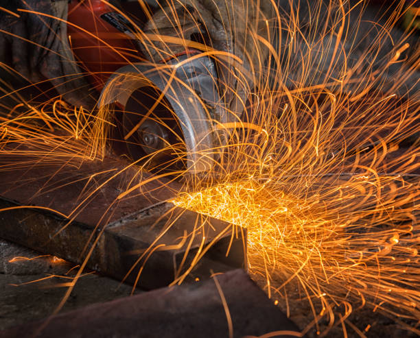 istock Industrial Worker labourer at the factory welding steel structure 873932240