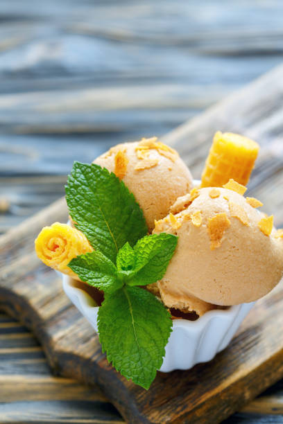istock Balls caramel ice cream with waffle crumb. 873932984