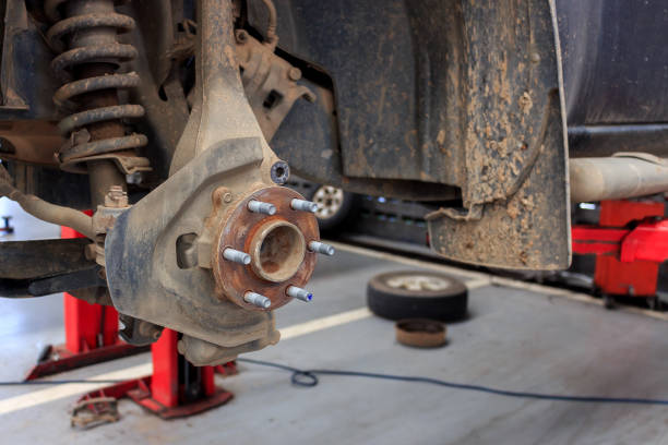 istock changing wheels on a car garage with soft-focus and over light  in the background 873933382
