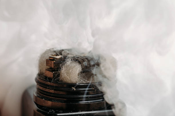 istock RDA atomizer for vaping or e-cigarette with Alien Clapton coil, process of making vapour, modern vape device for quit smoking 873935872