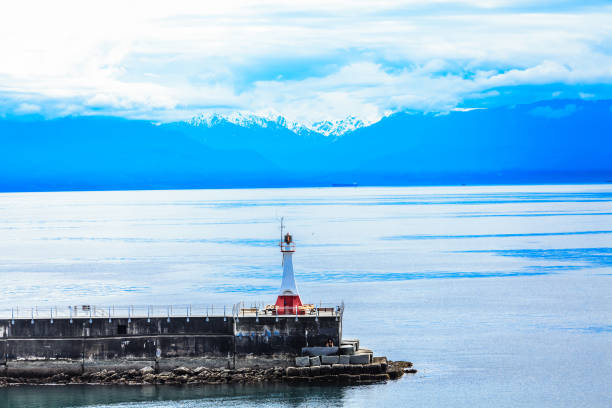 The lighthouse and seawall guarding the port in Victoria, British Columbia, Canada