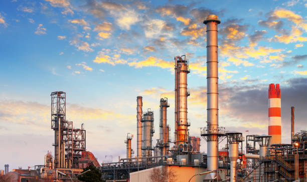 istock Factory with air pollution, Oil industry 873945098