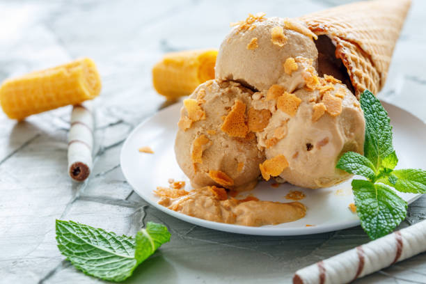 istock Homemade caramel ice cream with waffle crumb. 873945844