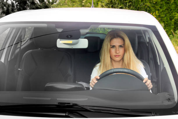 istock Woman is driving her car 873945900