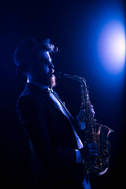 istock Jazz musician performing with a saxophone 873947220