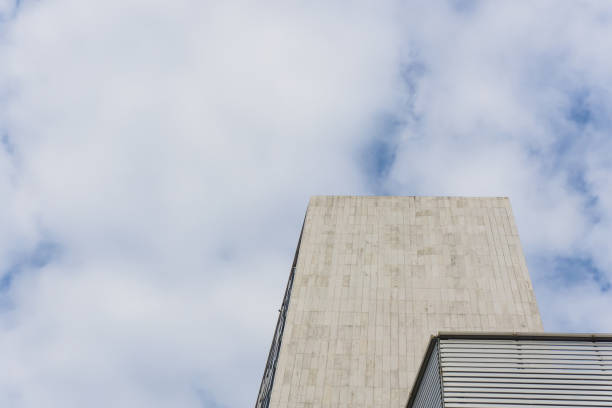 istock City skyscrapers and blue sky and white clouds. 873951702