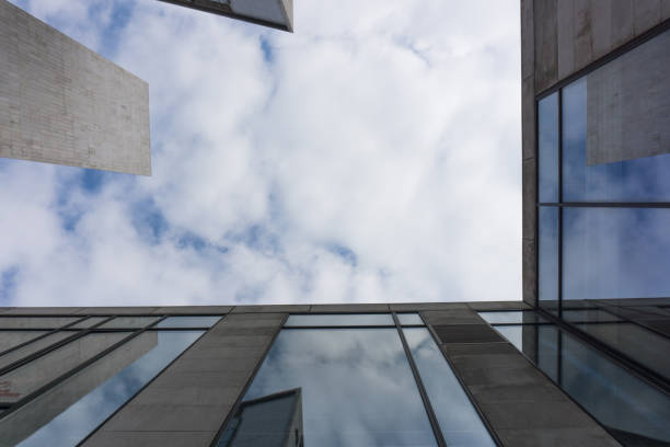 istock City skyscrapers and blue sky and white clouds. 873951904