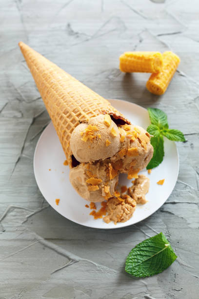 istock Waffle cone with homemade caramel ice cream. 873951948