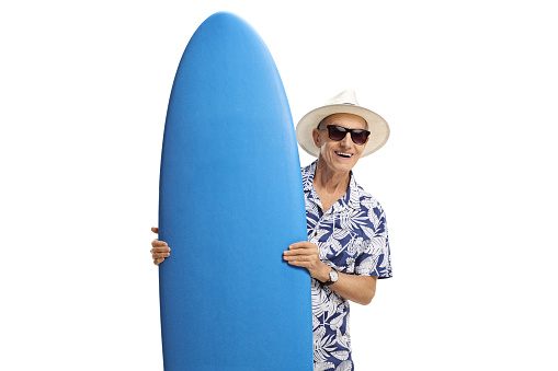 Elderly tourist holding a surfboard isolated on white background