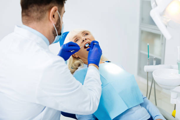 istock Concentrated dentist holding medical instrument 873952362