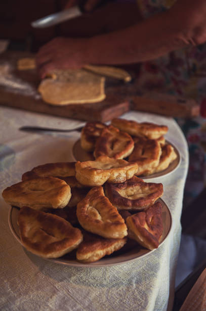 istock Grandmother bakes pies 873953912