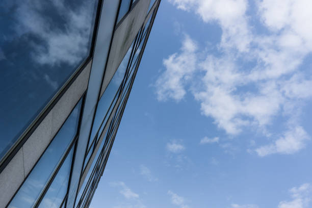 istock City skyscrapers and blue sky and white clouds. 873956534
