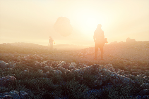 Young woman and futuristic cyborg astronaut with UFO.