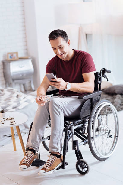 istock Attentive man playing with his gadget 873964950