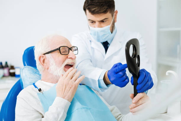 istock Close up of bearded man having a look at his teeth 873965004
