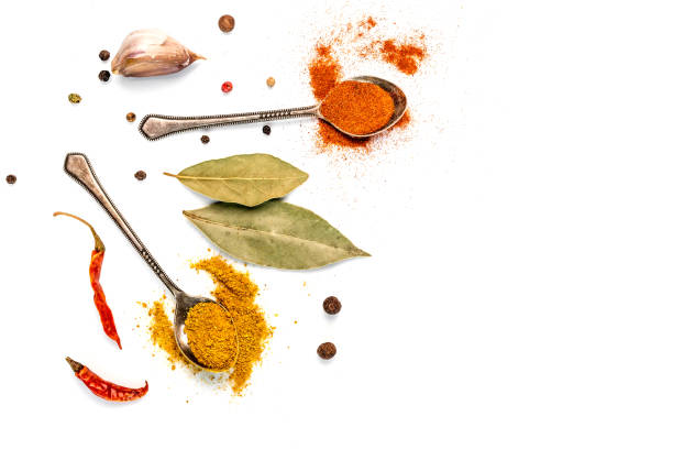 bay leaf, garlic and chilli pepper on a white background