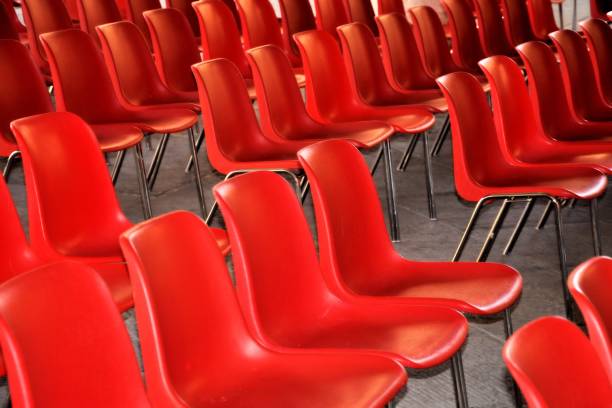 istock Red armchairs in a row for musical performance. 873967082