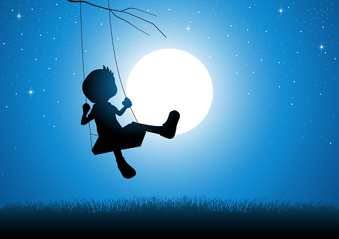Cartoon silhouette of a boy playing on a swing during full moon
