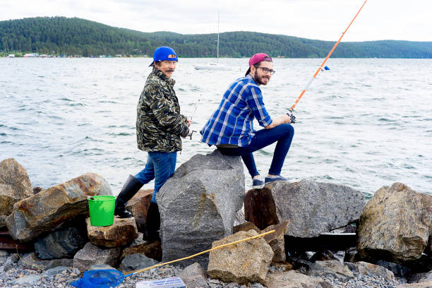 istock Father and son fishing 873979556