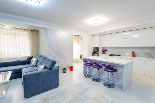istock Interior of modern white studio apartment with kitchen 873989150