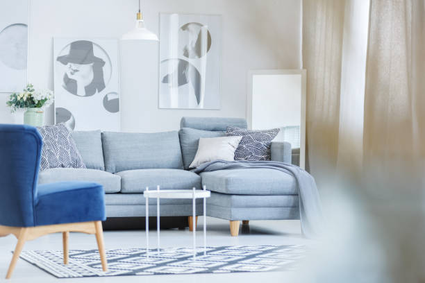 istock Monochromatic room with blue chair 873997304