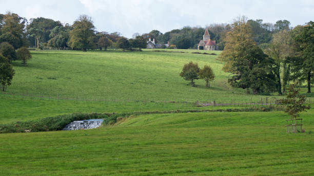 istock Village church overlooking Devon countryside UK 874000660