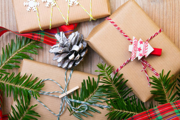 istock Christmas presents on wooden background, retro style with copy space 874001100