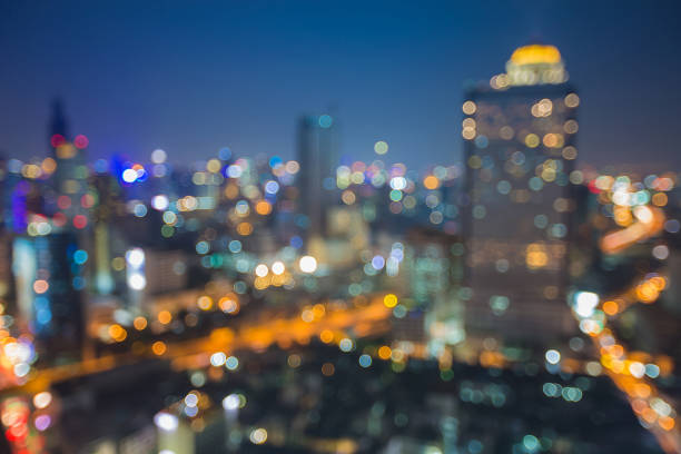 istock Night aerial view blurred bokeh city downtown skyline 874007360