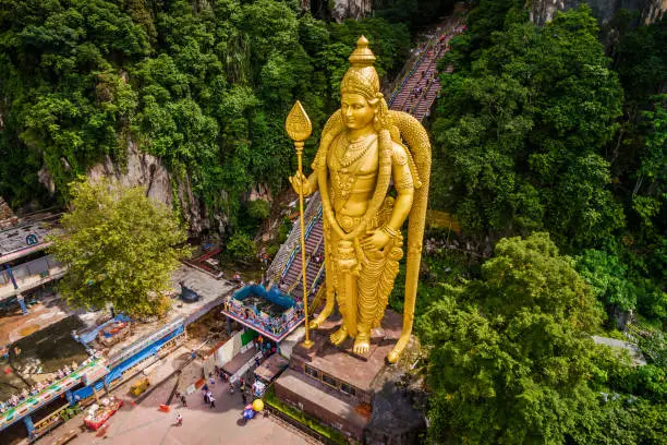 Batu Caves near Kuala Lumpur, Malaysia, aerial view of Lord Murugan Statue and entrance to the famous cave temples.