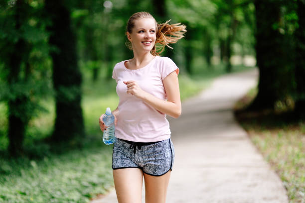 istock Beautiful jogging woman in nature 874017124