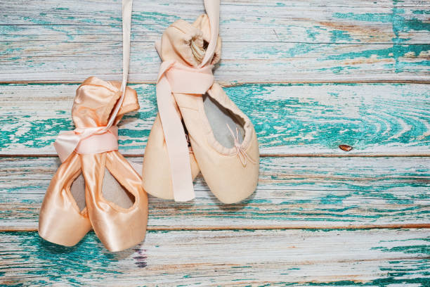 istock Two pairs of ballet shoes 874019376