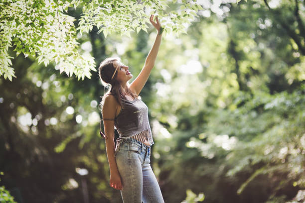 istock Happy cheerful female in nature 874019626