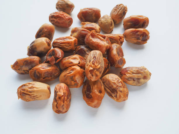 istock Delicious fresh organic dates over bright background 874023238