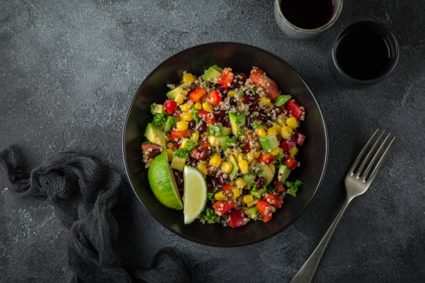 istock Avocado, quinoa, bean, corn and bell pepper salad 874029560