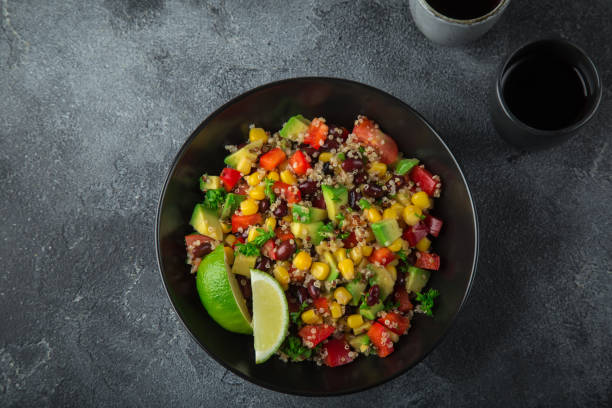 istock Avocado, quinoa, bean, corn and bell pepper salad 874029598