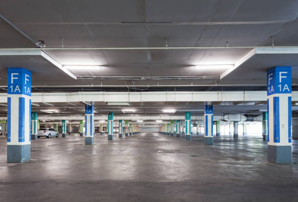 istock Empty parking garage underground interior in apartment or in supermarket. 874032130