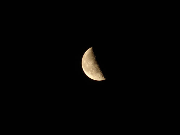 istock The crescent moon shining in the sky 874041662