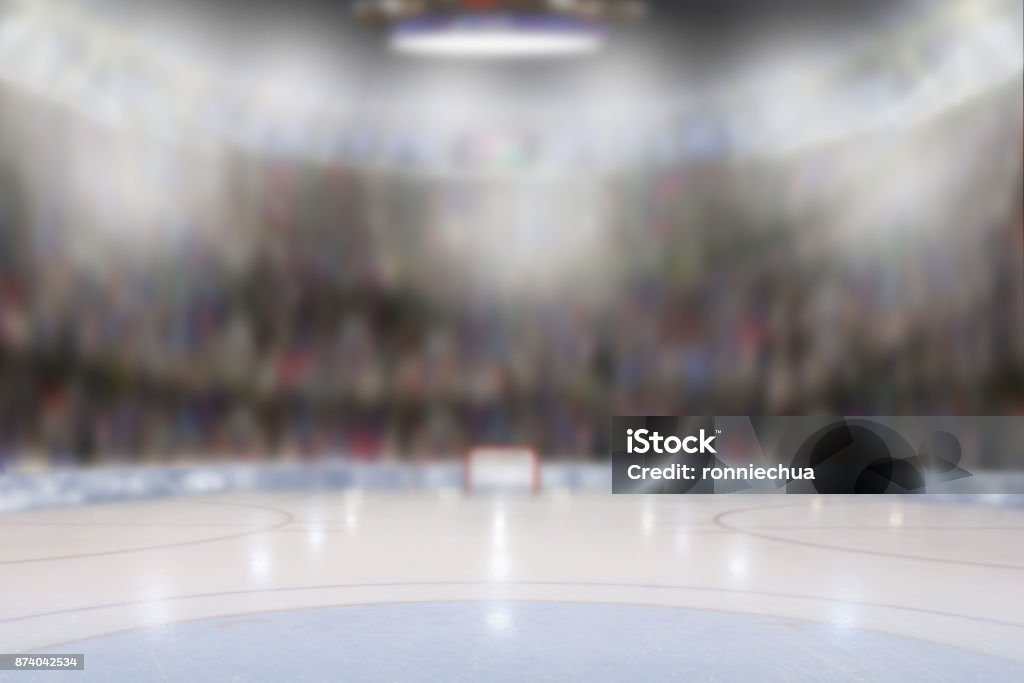 Ice Hockey Arena Low angle view of fictitious hockey arena with sports fans in the stands. Focus on foreground with deliberate shallow depth of field on background. Hockey Stock Photo