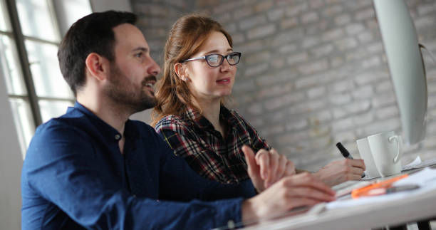 istock Portrait of young designers working on computer 874045244