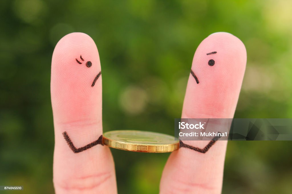 Fingers art of family during quarrel. Concept of man and woman cannot divide money after divorce. Currency Stock Photo