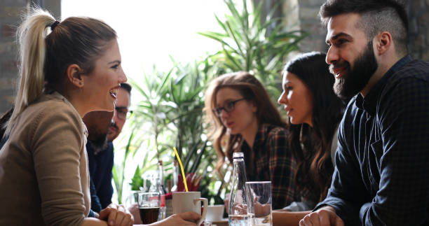 istock Happy colleagues from work socializing in restaurant 874046272