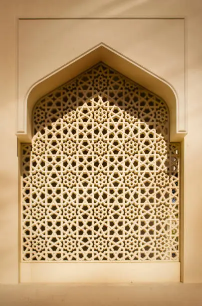 Islamic traditional architecture arabesque pattern arch window frame.