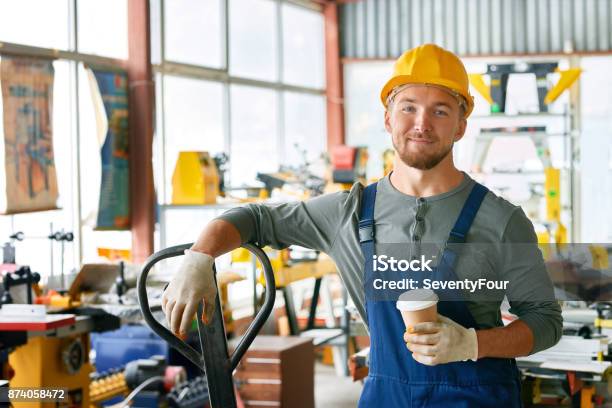 Smiling Young Workman On Break Stock Photo - Download Image Now - Manufacturing Occupation, Happiness, Portrait