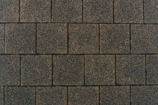 istock Grey brick stone street road. Light sidewalk, pavement texture. Road 874059642