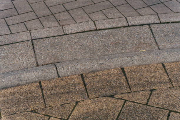 istock Grey brick stone street road. Light sidewalk, pavement texture. Road 874059868