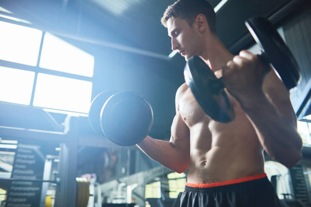 istock Strong Man Working Out in Gym 874062652