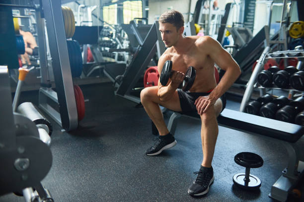 istock Handsome Man Working Out in Gym 874062690